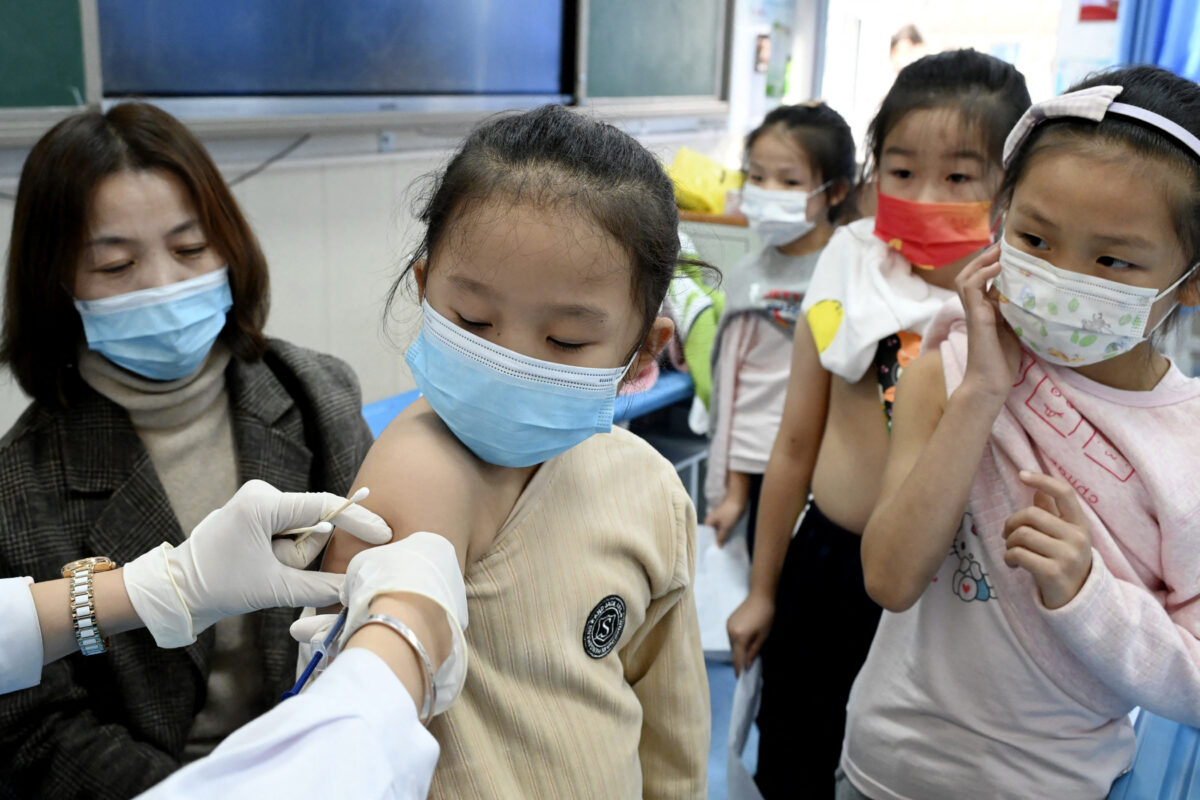 A child receives the COVID-19 vaccine at a school in Handan, in China's northern Hebei province on Oct. 27, 2021, after the city began vaccinating children between the ages of 3 to 11. (-/AFP via Getty Images)