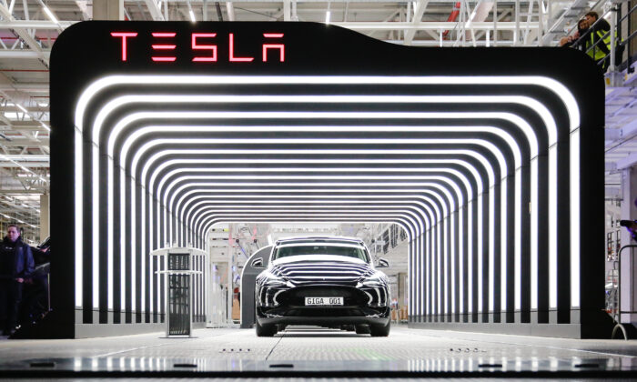 GRUENHEIDE, GERMANY - MARCH 22: A new Tesla car is seen during the official opening of the new Tesla electric car manufacturing plant on March 22, 2022 near Gruenheide, Germany. The new plant, officially called the Gigafactory Berlin-Brandenburg, is producing the Model Y as well as electric car batteries. (Photo by Christian Marquardt - Pool/Getty Images)