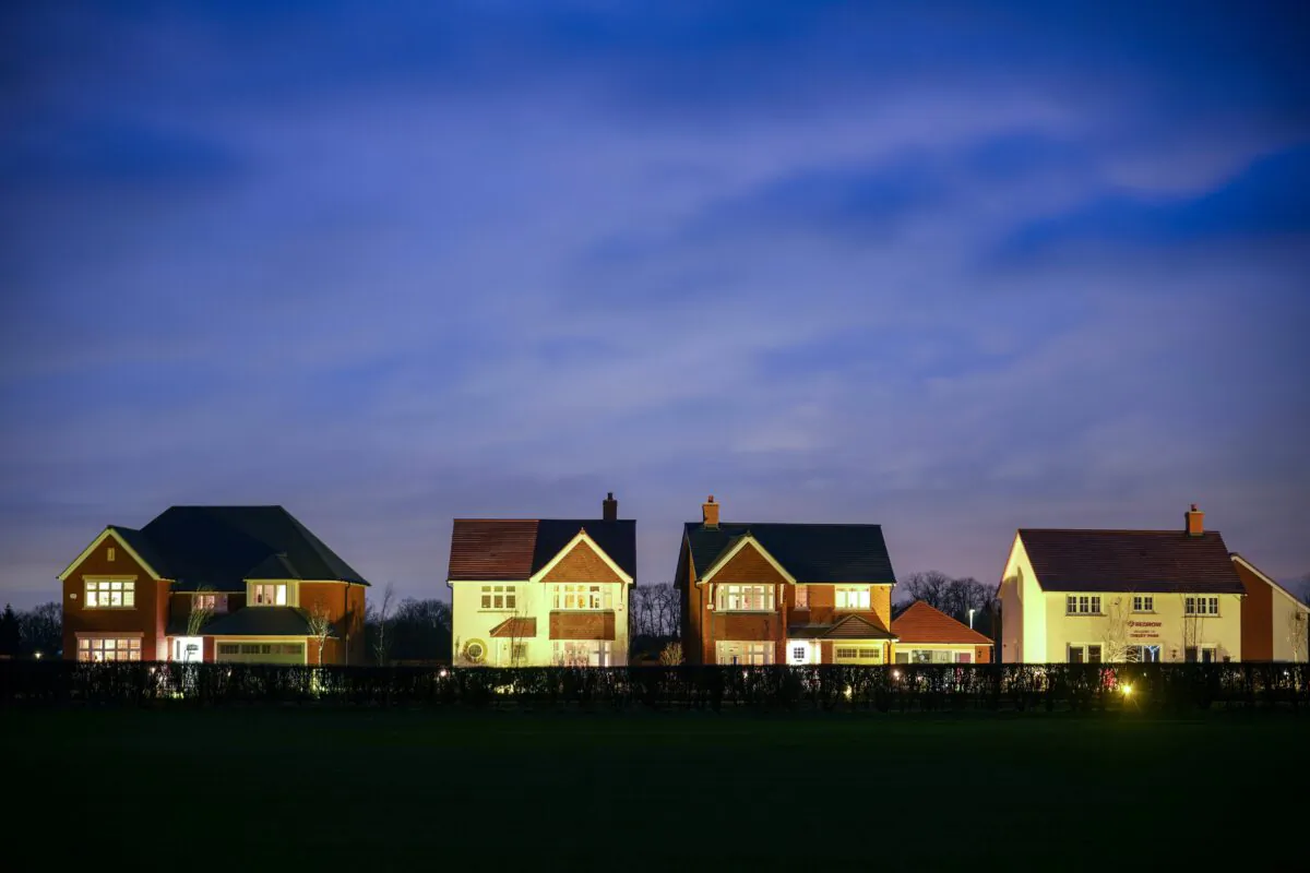 Recently constructed show homes are illuminated for potential buyers on a new housing estate in Knutsford, United Kingdom on Feb. 03, 2022. (Christopher Furlong/Getty Images)