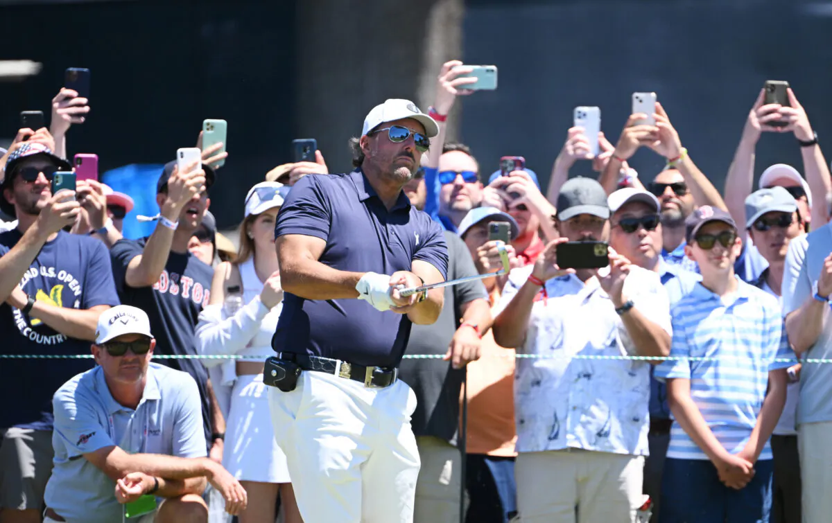 Fans watch Phil Mickelson of the United States as he plays his shot from the second tee during a practice round prior to the US Open at The Country Club, in Brookline, Mass., on June 14, 2022 (Ross Kinnaird/Getty Images)