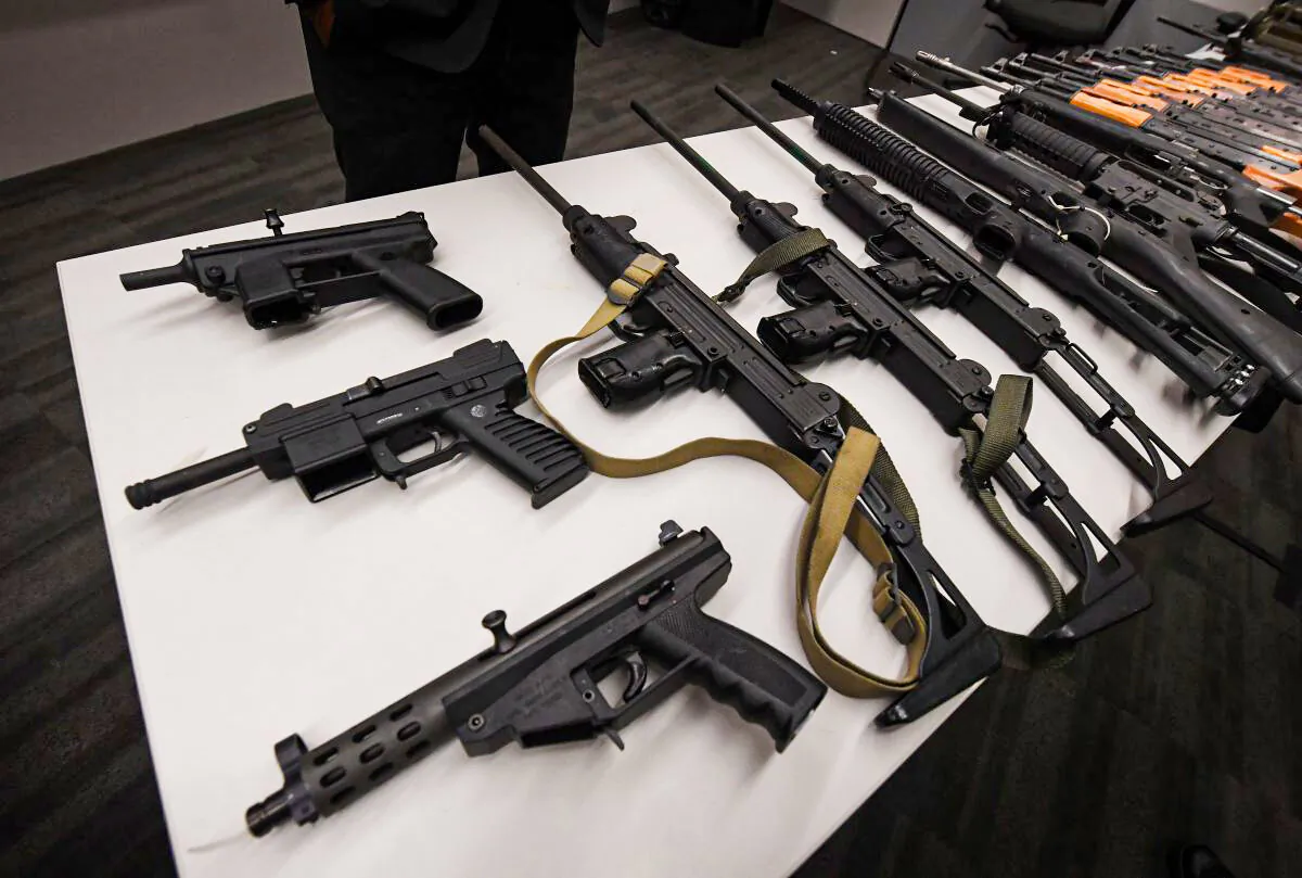Assault rifles and two rocket propelled grenade launchers on display at a press conference to show the results of an anonymous gun buyback program at police headquarters in Los Angeles on May 19, 2017. (Mark Ralston/AFP/Getty Images)