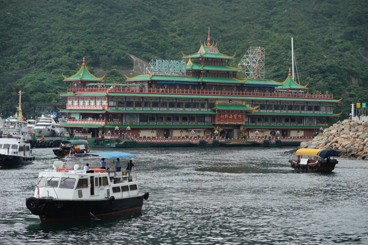 Hong Kong's iconic Jumbo Floating Restaurant is towed away in Hong Kong on June 14, 2022. (Kin Cheung/AP Photo)