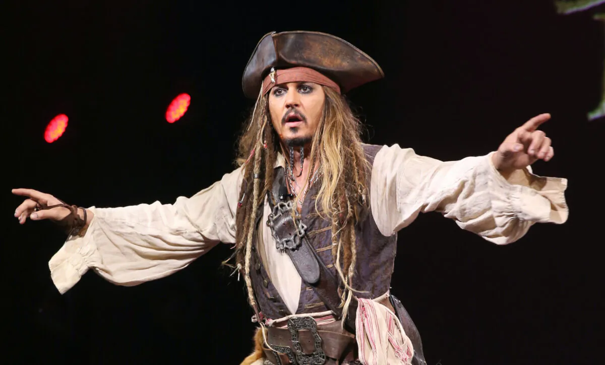 Actor Johnny Depp, dressed as Captain Jack Sparrow, of "Pirates of the Caribbean: Dead Men Tell No Tales" takes part in "Worlds, Galaxies, and Universes: Live Action at The Walt Disney Studios" presentation at Disney's D23 EXPO 2015 in Anaheim, Calif., on Aug. 15, 2015. (Jesse Grant/Getty Images for Disney)