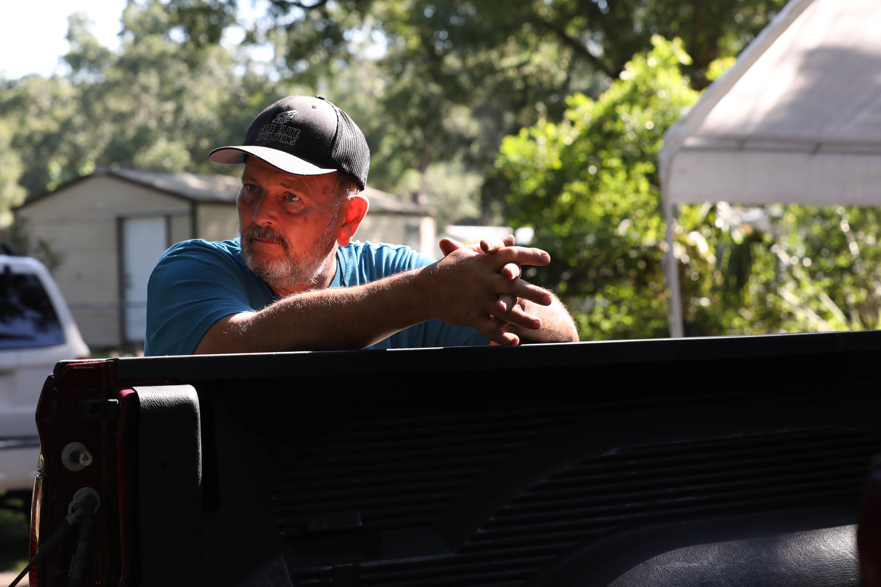 Gary Cananzey observes as archaeologist Rachel Kangas identifies artifacts found on Cananzey's nephew's property.