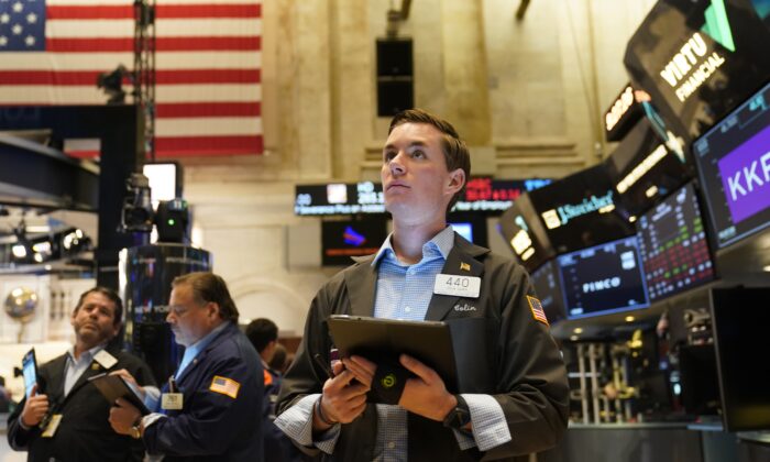 Traders work on the floor at the New York Stock Exchange in New York, on June 14, 2022. (Seth Wenig/AP Photo)