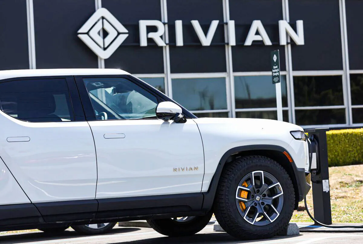 A Rivian electric pickup truck sits in a parking lot at a Rivian service center in South San Francisco on May 9, 2022. (Justin Sullivan/Getty Images)
