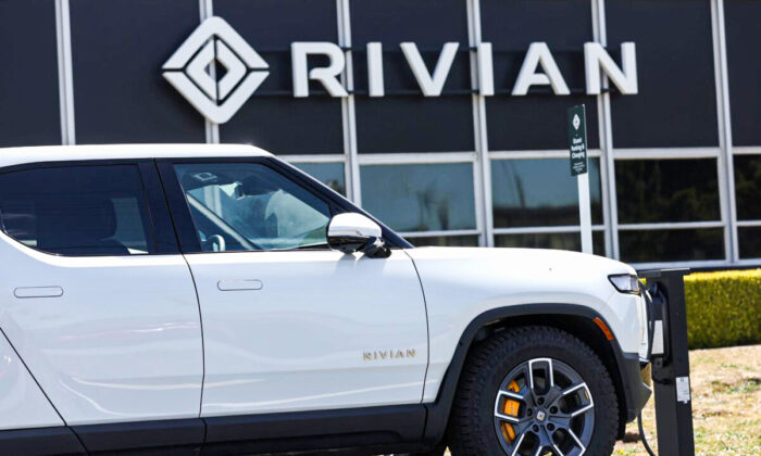 A Rivian electric pickup truck sits in a parking lot at a Rivian service center in South San Francisco on May 09, 2022. (Justin Sullivan/Getty Images)
