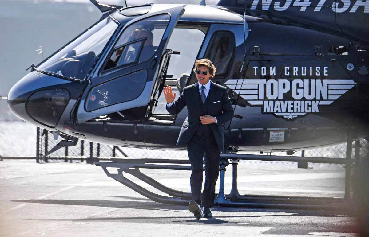 Actor Tom Cruise arrives in a helicopter to the world premiere of "Top Gun: Maverick" aboard the USS Midway in San Diego, on May 4, 2022. (Robyn Beck/AFP via Getty Images)