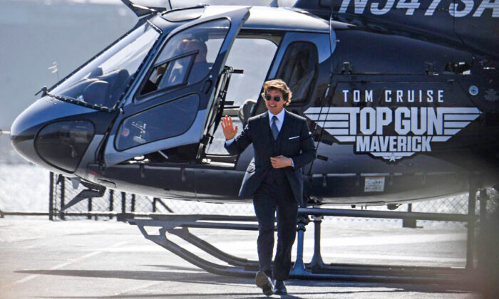 Actor Tom Cruise arrives in a helicopter to the world premiere of "Top Gun: Maverick" aboard the USS Midway in San Diego, on May 4, 2022. (Robyn Beck/AFP via Getty Images)