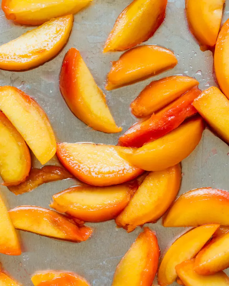 Freezing peaches with a little lemon juice instead of sugar or syrup allows their sweet, juicy flavor to shine. (Christine Han/TNS)