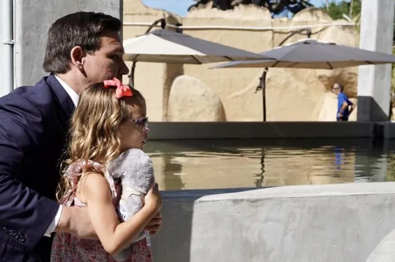 Florida Gov. Ron DeSantis shown with daughter Madison looking at the Manatees in Jacksonville. The Governor often brings his children to press events. May 5, 2022. (Courtesy, The Governor's office)