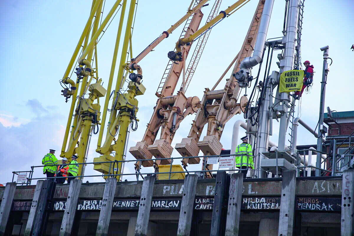 Greenpeace climbers block a tanker carrying 33,000 tonnes of Russian diesel to the UK at Navigator Terminals in Essex. (Greenpeace/ Fionn Guilfoyle/ PA)