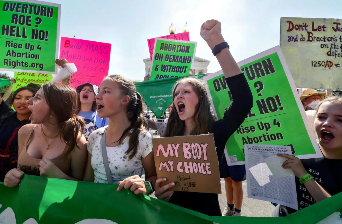 Abortion protesters demonstrate outside of the Supreme Court of the United States in Washington, U.S., on June 13, 2022. (Reuters/Evelyn Hockstein)