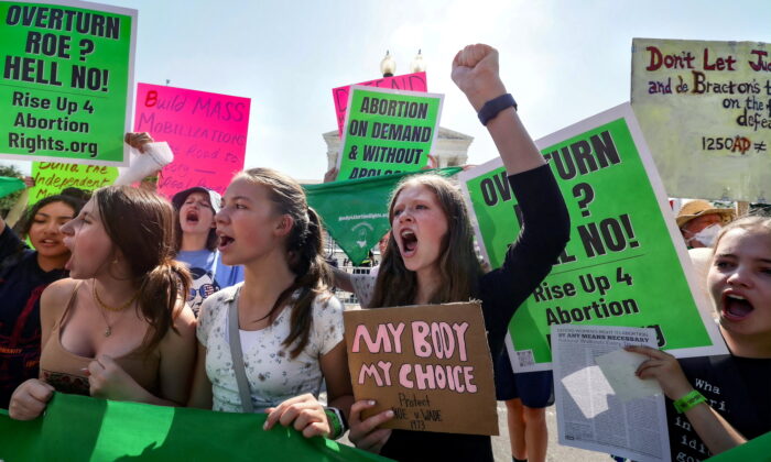 Abortion protesters demonstrate outside of the Supreme Court of the United States in Washington, U.S., on June 13, 2022. (Reuters/Evelyn Hockstein)