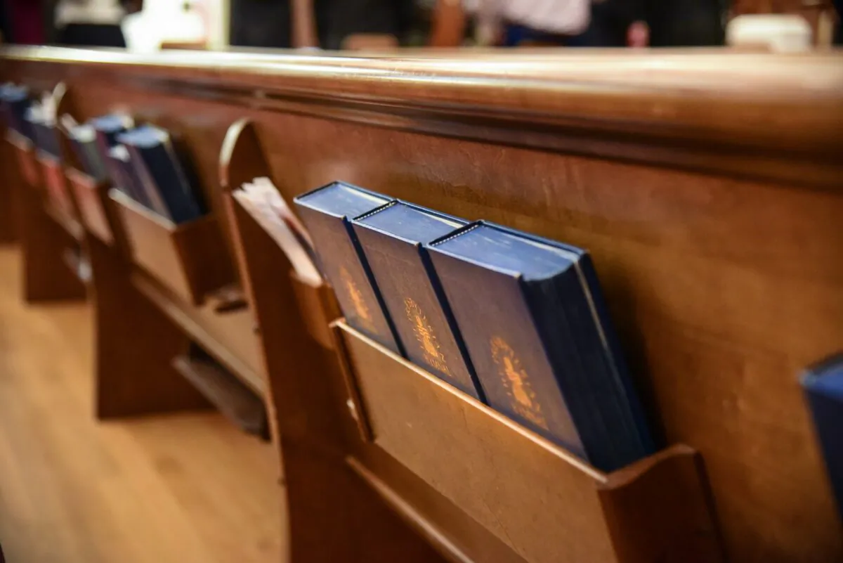 This file photo shows hymnals in a church pew. (Kyler Nixon/Unsplash)