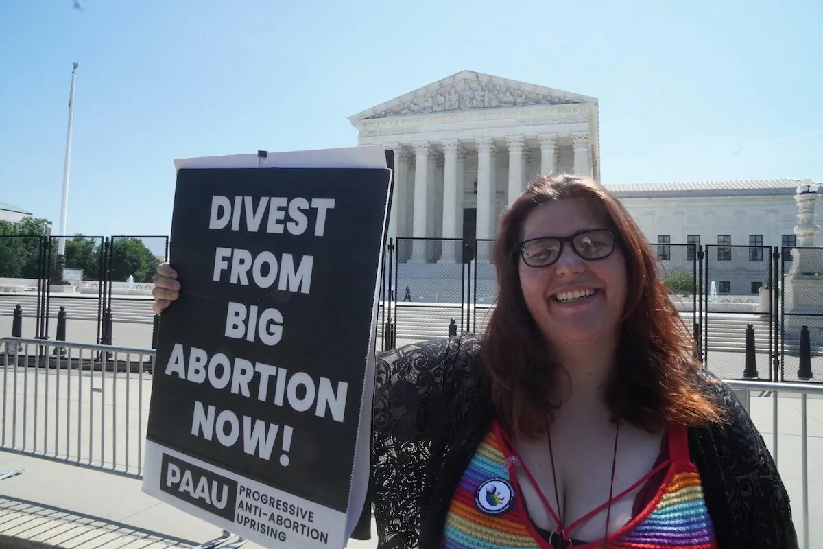 Left-wing pro-life protester Lauren Handy, the director of activism with Progressive Anti-Abortion Uprising, protests outside the U.S. Supreme Court, on June 15, 2022 (Jackson Elliott/The Epoch Times)