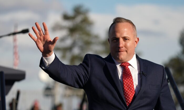 House of Representatives candidate Russell Fry waves to a crowd during a rally with former President Donald Trump at the Florence Regional Airport in Florence, S.C., on March 12, 2022. (Sean Rayford/Getty Images)