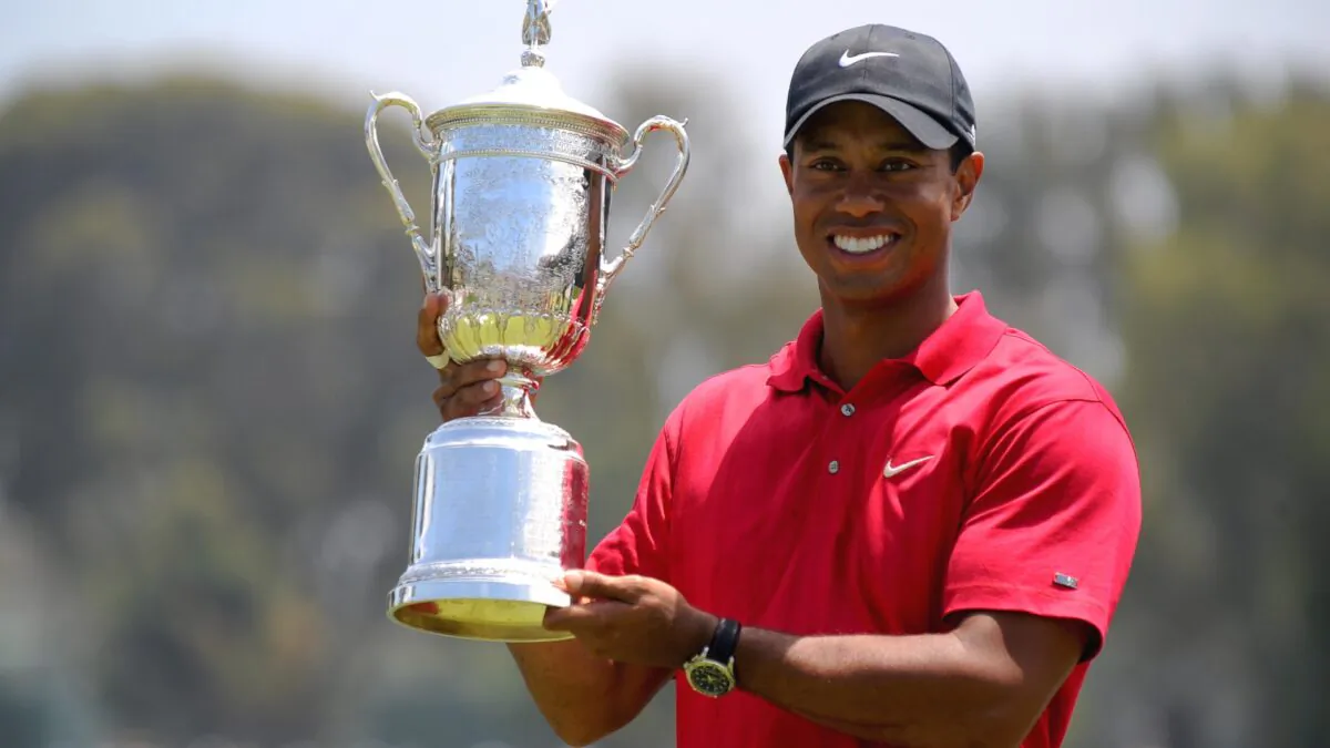 Tiger Woods of the U.S. holds his trophy after defeating compatriot Rocco Mediate in the sudden death playoff at the 108th U.S. Open golf tournament at Torrey Pines Golf Course in San Diego, Calif., on June 16, 2008. (Robyn Beck/AFP via Getty Images)