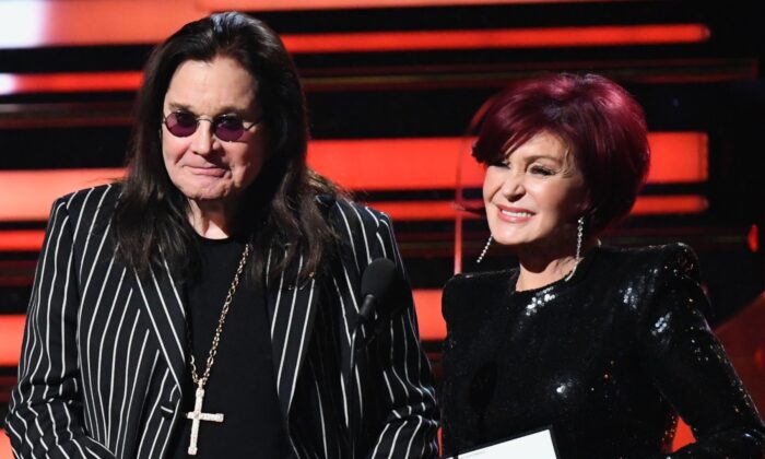 British singer Ozzy Osbourne (L) and wife British television personality Sharon Osbourne present the award for Best Rap/Sung Performance during the 62nd Annual Grammy Awards in Los Angeles, Calif., on Jan. 26, 2020. (Robyn Beck/AFP via Getty Images)