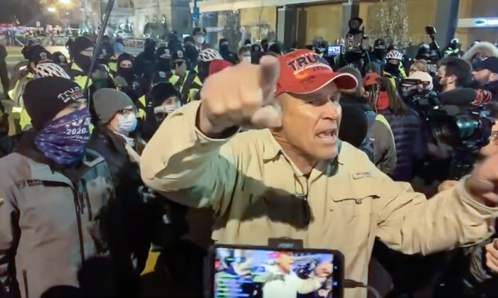 Ray Epps encourages protesters to go into the U.S. Capitol the night before the breach of Jan. 6, 2021. (Villain Report/Screenshot via The Epoch Times)