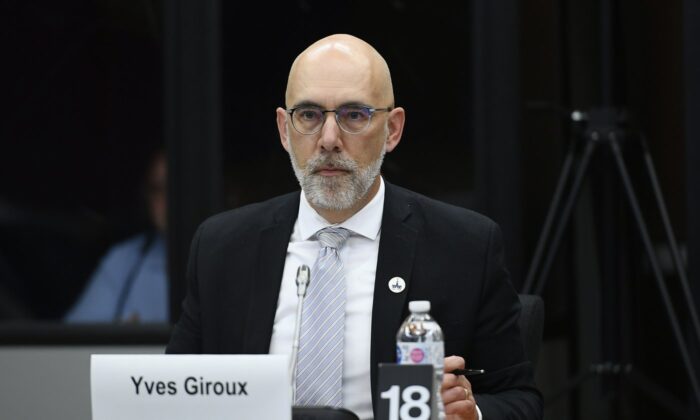 Parliamentary budget officer Yves Giroux prepares to appear before the Senate Committee on Official Languages, in Ottawa, on June 13, 2022. (The Canadian Press/Justin Tang)