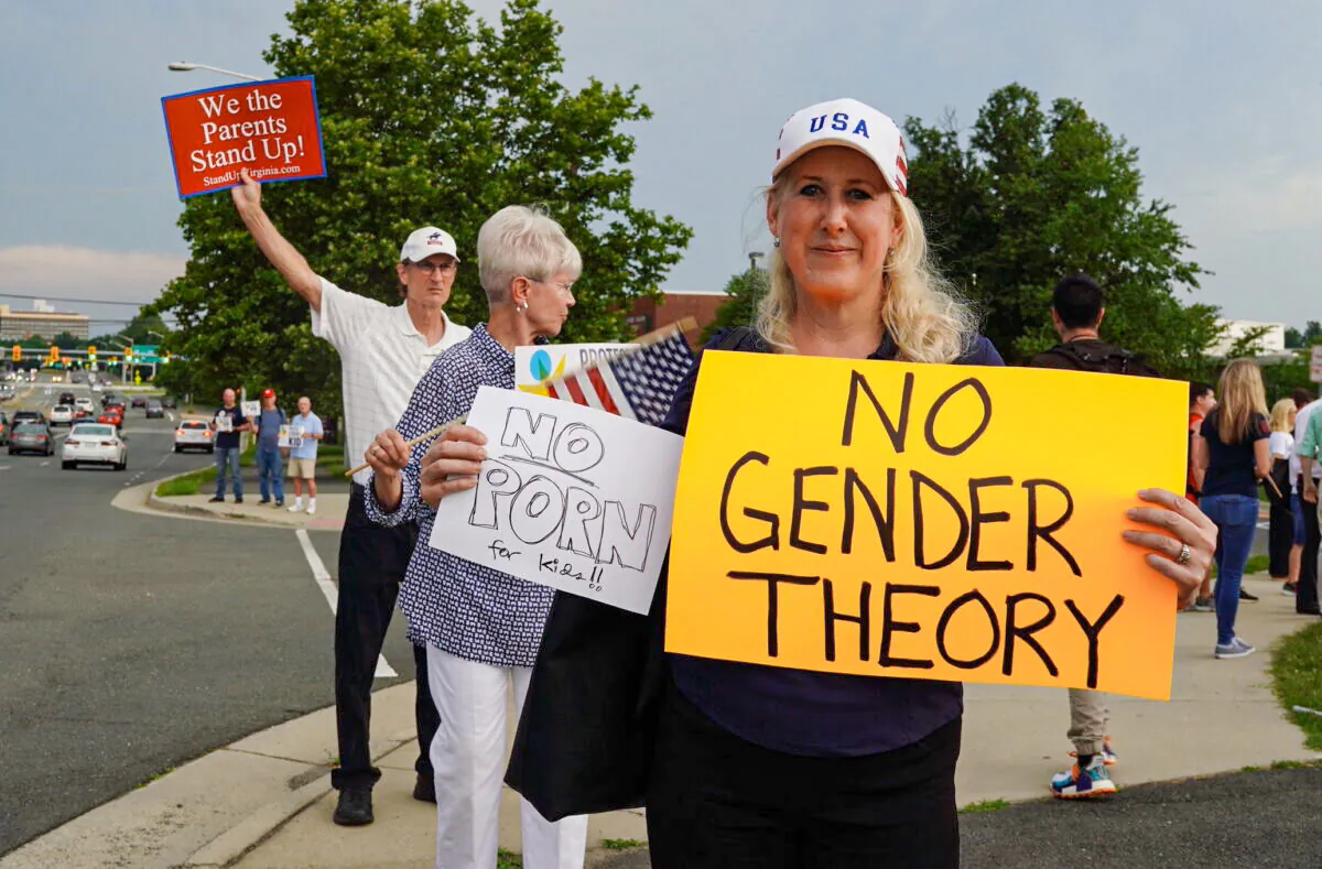 Jean Ballard protests Fairfax County school board’s pro-transgender policy outside of the Luther Jackson Middle School in Falls Church, Va., on June 16, 2022. (Terri Wu/The Epoch Times)