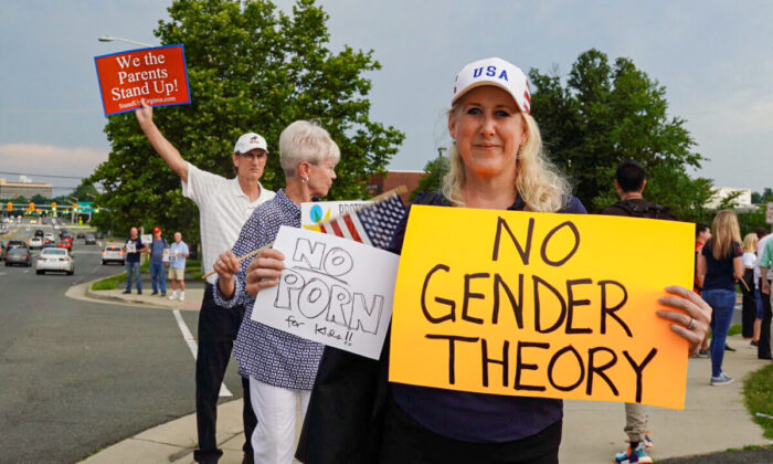 Jean Ballard protests Fairfax County school board’s pro-transgender policy outside of the Luther Jackson Middle School in Falls Church, Va., on June 16, 2022. (Terri Wu/The Epoch Times)