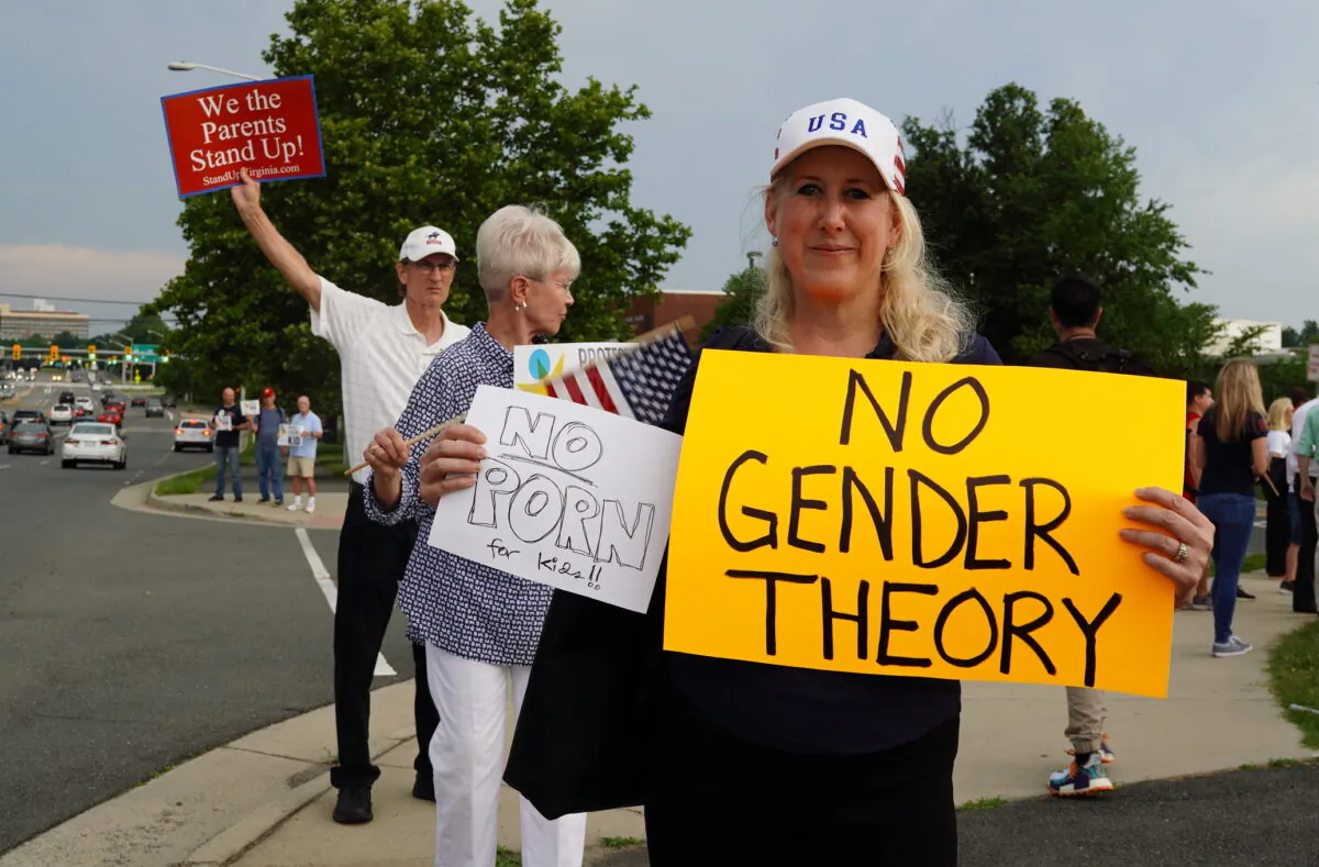 Jean Ballard protests against Fairfax County school board’s pro-transgender policy outside of the Luther Jackson Middle School in Falls Church, Va., on June 16, 2022. (Terri Wu/The Epoch Times)