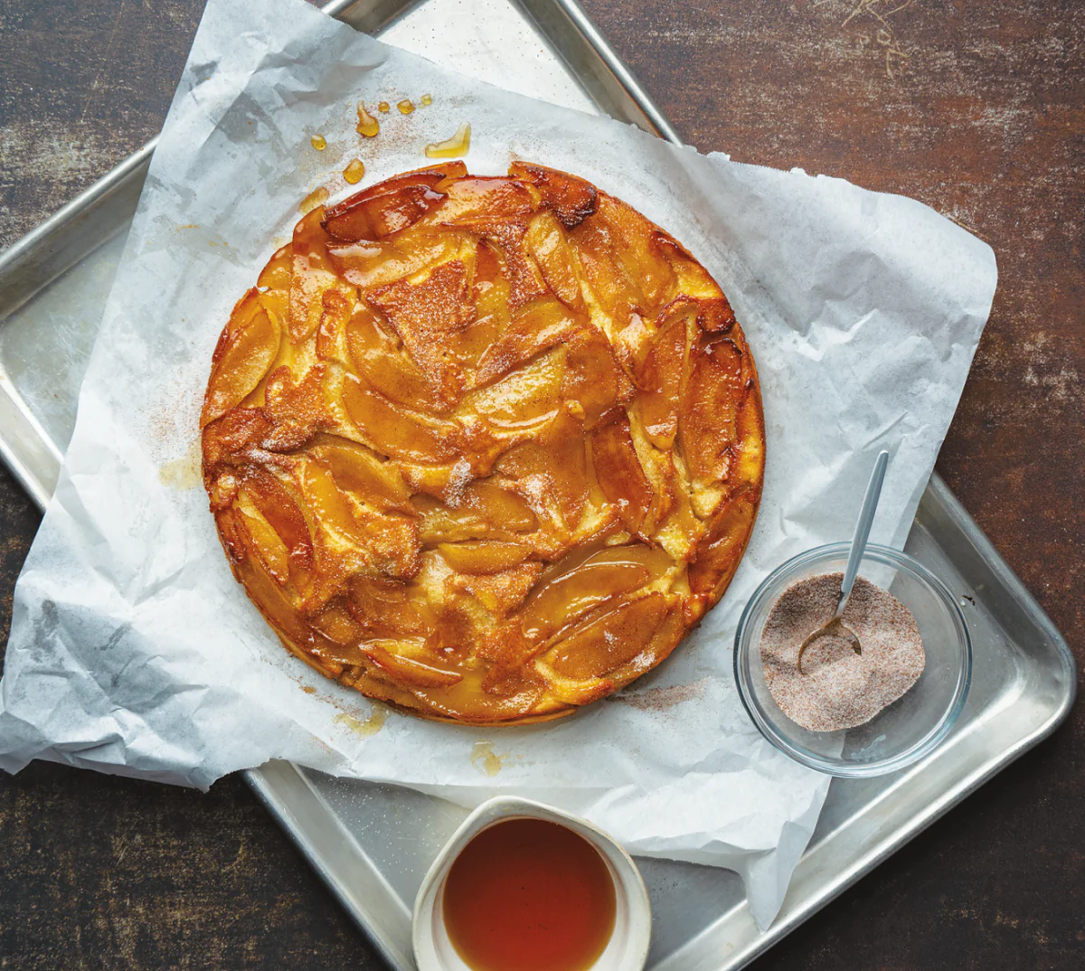 This caramelized apple-studded pancake makes a convincing case for firing up the grill in the morning. (Ken Goodman)