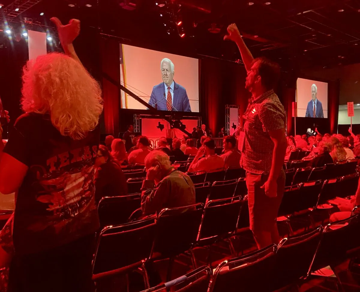 Delegates at the Texas GOP state convention in Houston on June 17, 2022, gave U.S. Sen. John Cornyn a thumbs down for working with Democrats to incentivize red flag laws. (Darlene McCormick Sanchez/The Epoch Times)