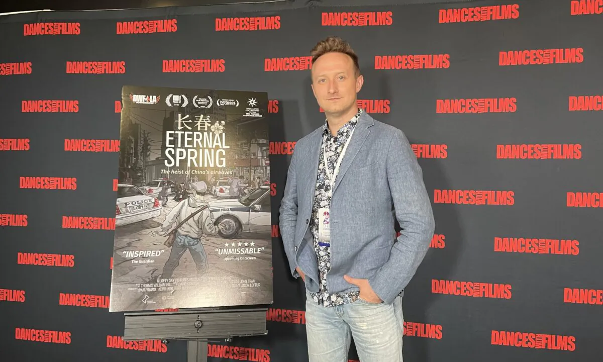 Jason Loftus, director of award-winning documentary "Eternal Spring" poses for photographs at the Southern California premiere of the film at Chinese Theatre in Hollywood, Los Angeles, on June 15, 2022. (Alice Sun/The Epoch Times)