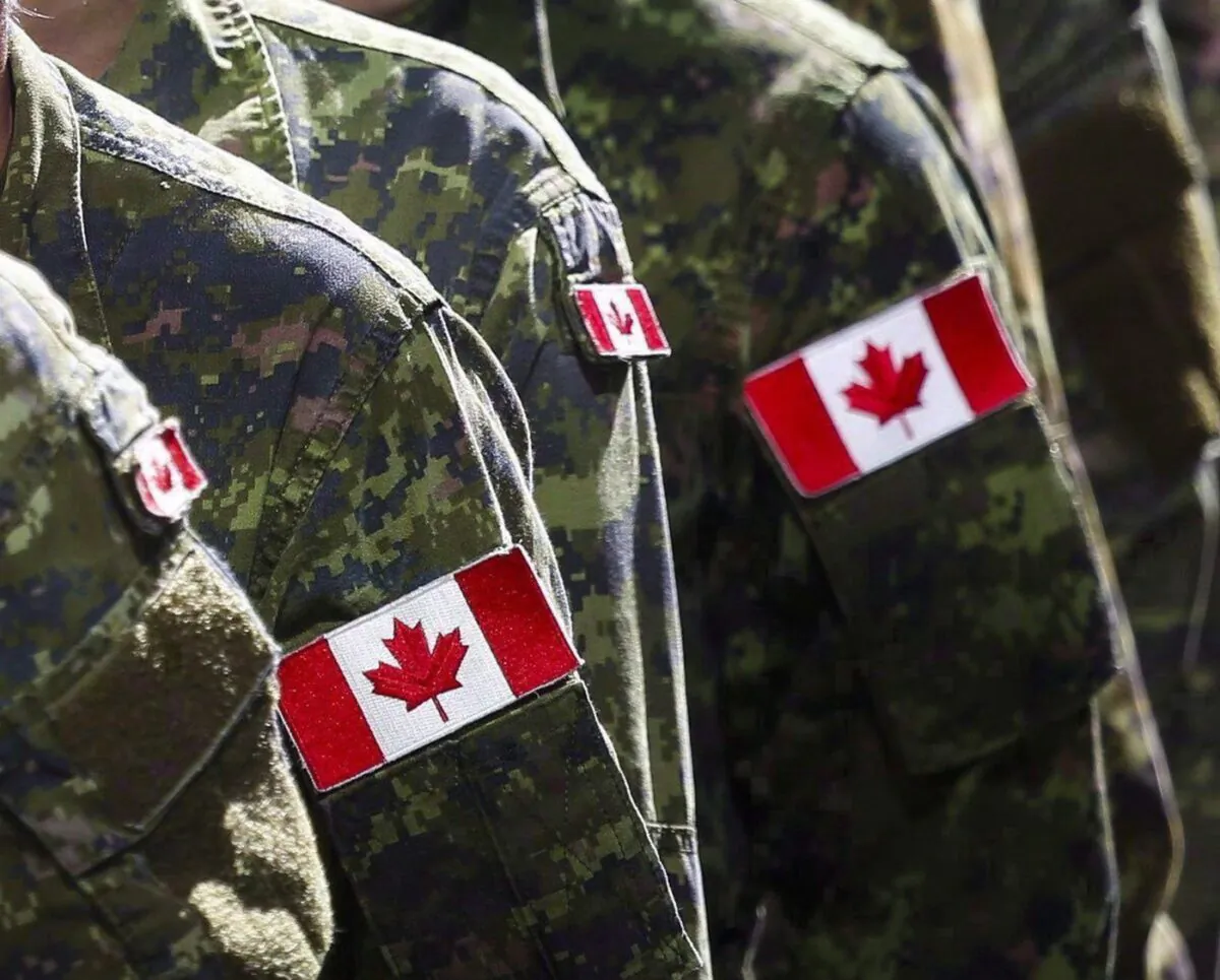 Members of the Canadian Armed Forces march during the Calgary Stampede parade in Calgary on July 8, 2016. (The Canadian Press/Jeff McIntosh)