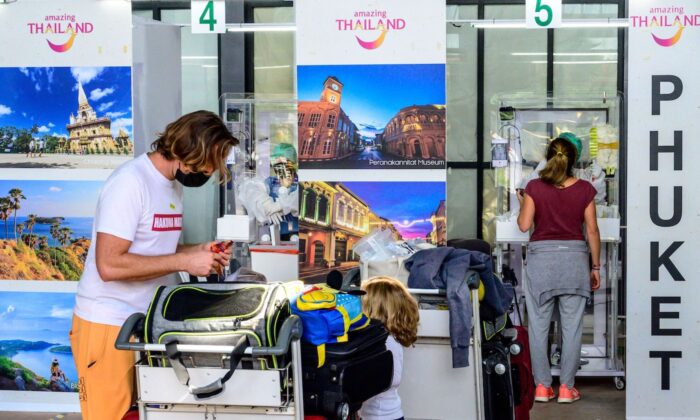 Passengers wait for a PCR swab test for COVID-19 after arriving at Phuket International Airport in Thailand on Nov.1, 2021. (Mladen Antonov/AFP via Getty Images)