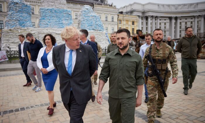 British Prime Minister Boris Johnson and Ukraine's President Volodymyr Zelenskyy walk at Mykhailivska Square, in Kyiv, Ukraine, on June 17, 2022. (Ukrainian Presidential Press Service via Reuters)