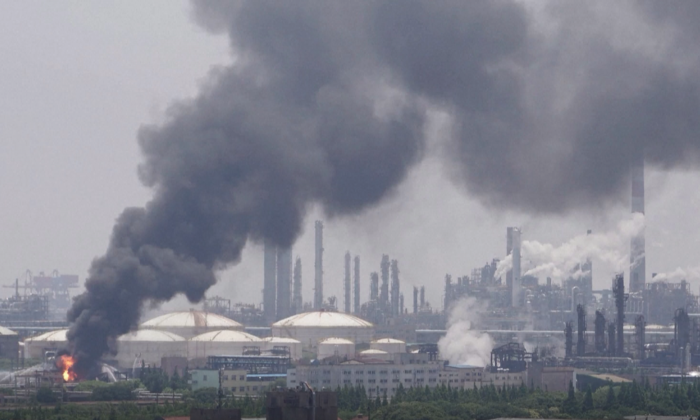 Smoke comes out from a Sinopec Shanghai Petrochemical plant in the Jinshan district of Shanghai on June 18, 2022, in a still from video. (Reuters/Screenshot via The Epoch Times)