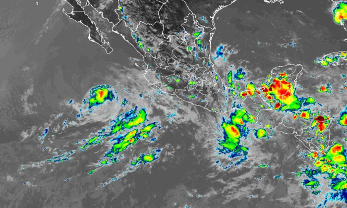 A satellite image shows Tropical Storm Blas off the southern Pacific coast of Mexico and Tropical Depression Celia off the Pacific coast of El Salvador and Guatemala at 4:40 p.m. ET on June 18, 2022. (NOAA)
