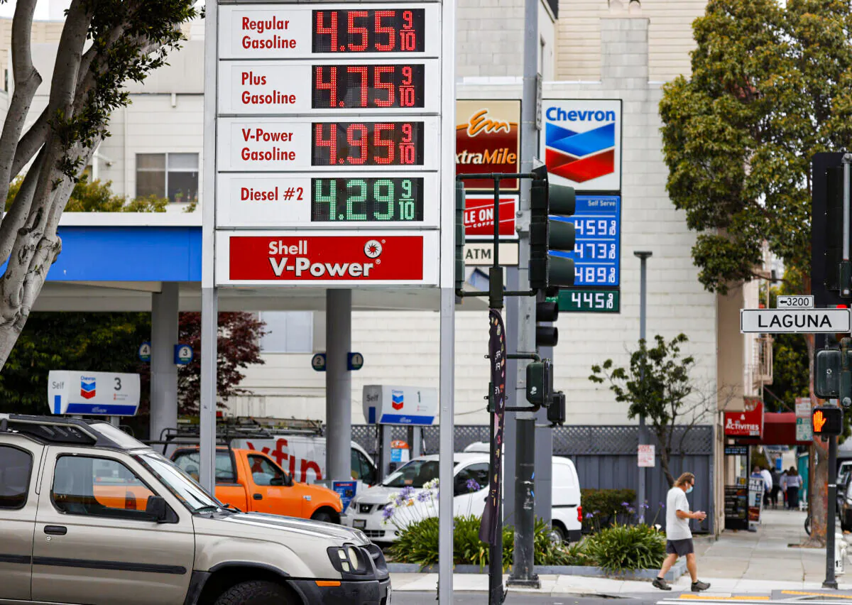 Gas prices nearing $5.00 a gallon are displayed at Chevron and Shell stations in San Francisco, Calif., on July 12, 2021. (Justin Sullivan/Getty Images)
