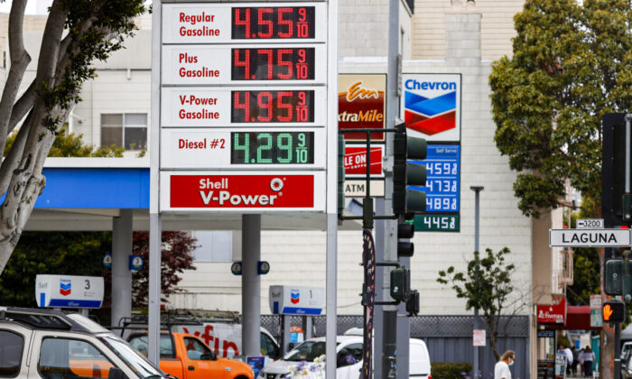 Gas prices nearing $5 per gallon are displayed at Chevron and Shell stations in San Francisco on July 12, 2021. (Justin Sullivan/Getty Images)