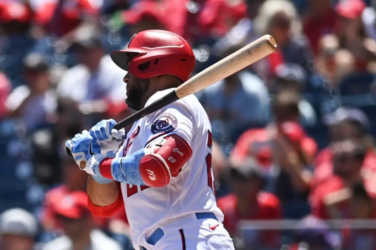 Washington Nationals designated hitter Nelson Cruz (23) singles during the first inning against the Philadelphia Phillies at Nationals Park in Washington on June 19, 2022. (Tommy Gilligan/USA TODAY Sports via Field Level Media)