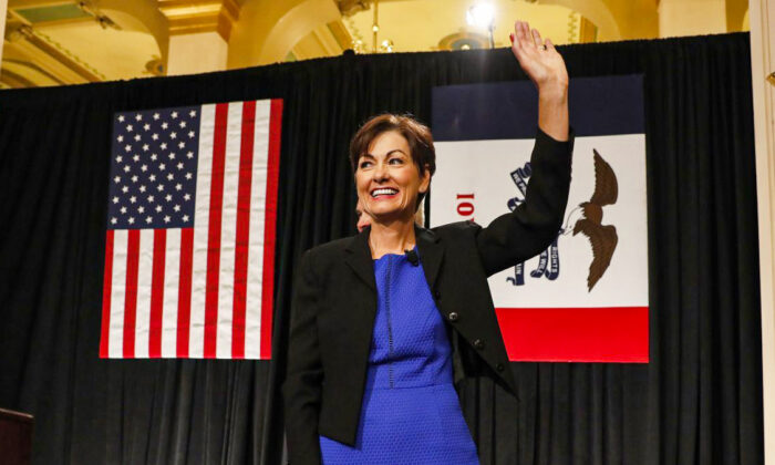 Iowa Gov. Kim Reynolds waves after speaking during a ceremonial swearing-in at the Statehouse in Des Moines, Iowa on May 24, 2017. (AP Photo/Charlie Neibergall)