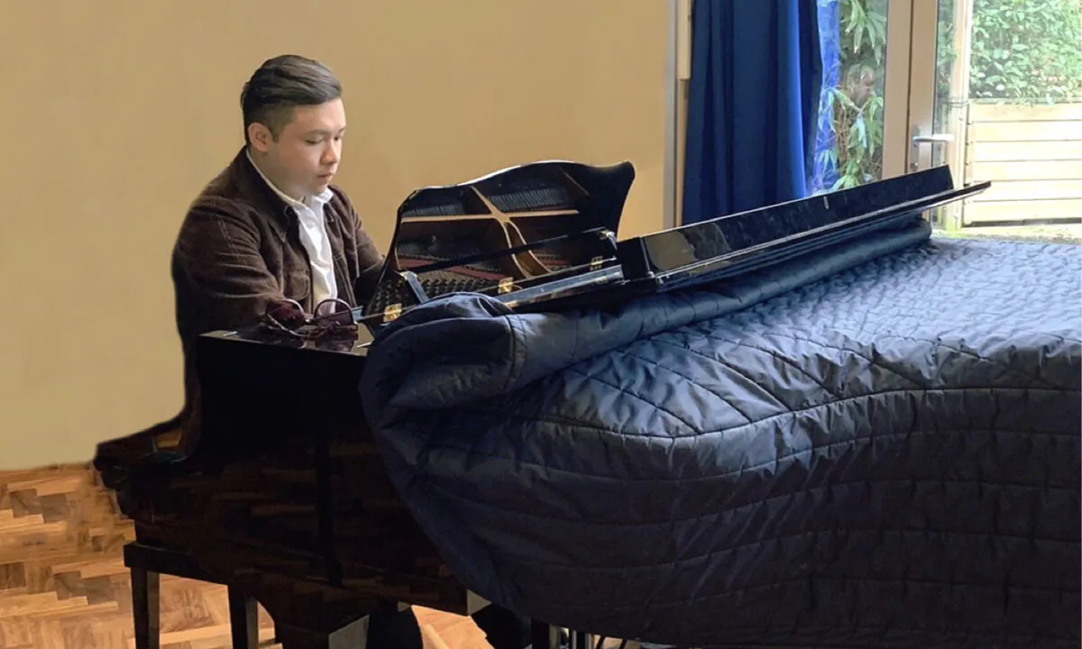 Young musician Xavier came to London by himself. He is now a piano teacher and started his own company.(Courtesy of Xavier Cheung)
