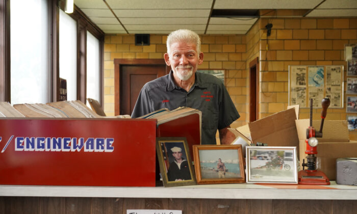 John Shotts stands in his auto repair business office in Galesburg, Ill., on June 7, 2022. (Cara Ding/The Epoch Times)