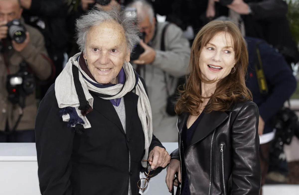 Actors Jean-Louis Trintignant (L) and Isabelle Huppert pose during a photo call for Love at the 65th international film festival, in Cannes, southern France, on May 20, 2012. (Joel Ryan/AP Photo)