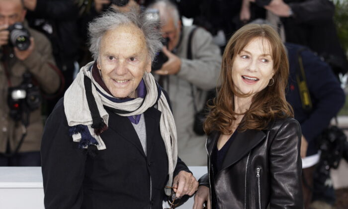 Actors Jean-Louis Trintignant (L) and Isabelle Huppert pose during a photo call for Love at the 65th international film festival, in Cannes, southern France, on May 20, 2012. (Joel Ryan/AP Photo)