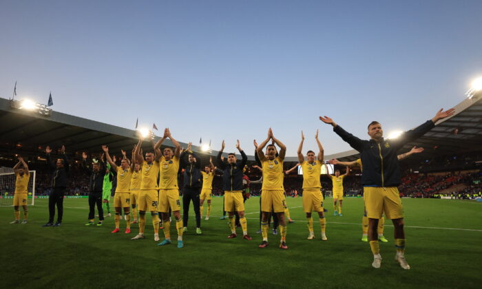 Ukraine celebrates and applauds its fans after the match and its victory during the FIFA World Cup Qualifier match between Scotland and Ukraine at Hampden Park in Glasgow, Scotland, on June 1, 2022. (Lee Smith/Action Images via Reuters)