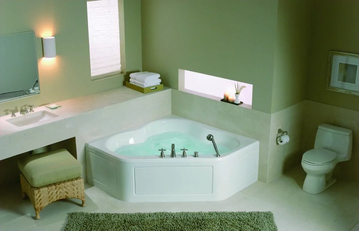 Corner baths are designed to open up floor space by using up as much corner space as possible. (Kohler/TNS)