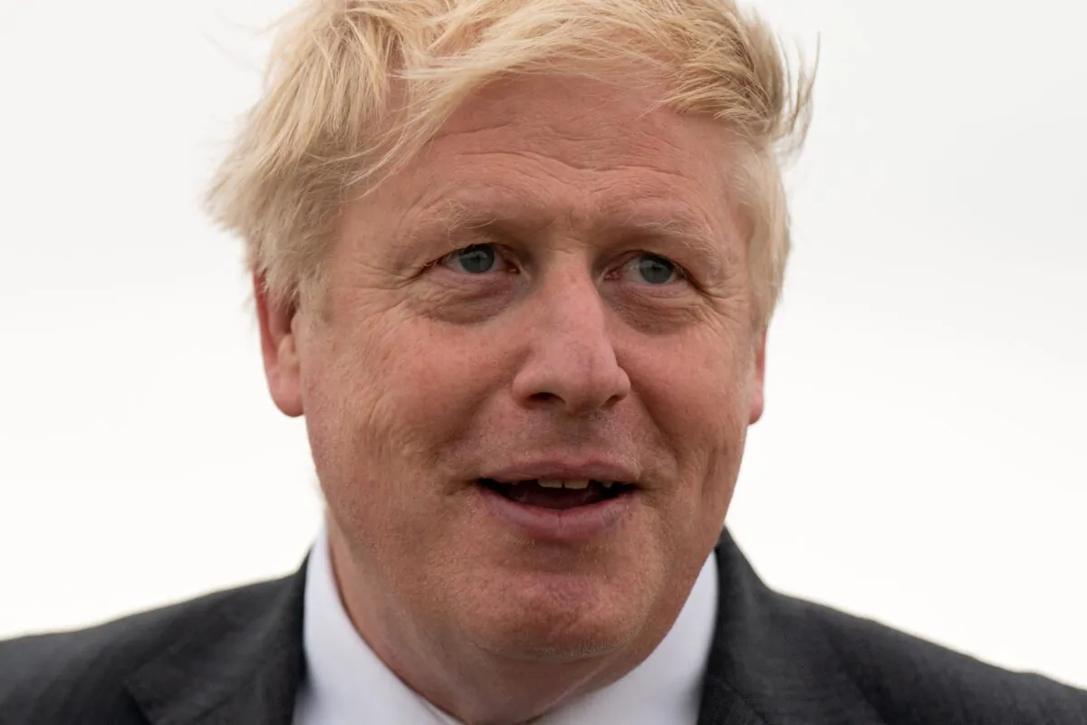 Britain's Prime Minister Boris Johnson speaks to members of the media after returning from Kyiv to RAF Brize Norton, west of London, on June 18, 2022. (Joe Giddens /pool/AFP via Getty Images)