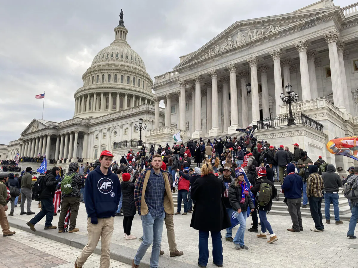 Even after Capitol occupation and violence on January 6, 2021, Capitol Hill Police made no attempt to apprehend "Q Anon Man," who is on the Senate steps just a few feet from the Capitol Hill Police line. This photo was taken after the Capitol Hill Police removed protesters from inside the Senate wing of the Capitol. (Courtesy of J. Michael Waller)