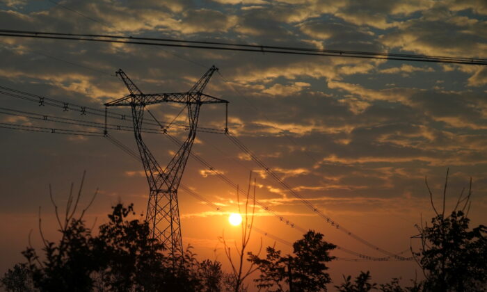 Electricity pylon and powers lines in Nanyang, Henan province, China, on Oct. 13, 2021. (Aly Song/Reuters)