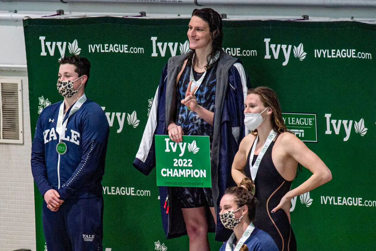 Transgender swimmer Lia Thomas (2nd L) of Penn University and transgender swimmer Iszac Henig (L) of Yale pose with their medals after placing first and second in the 100-yard freestyle swimming race at the 2022 Ivy League Women's Swimming & Diving Championships at Harvard University in Cambridge, Mass., on Feb. 19, 2022. (Joseph Prezioso/Getty Images)